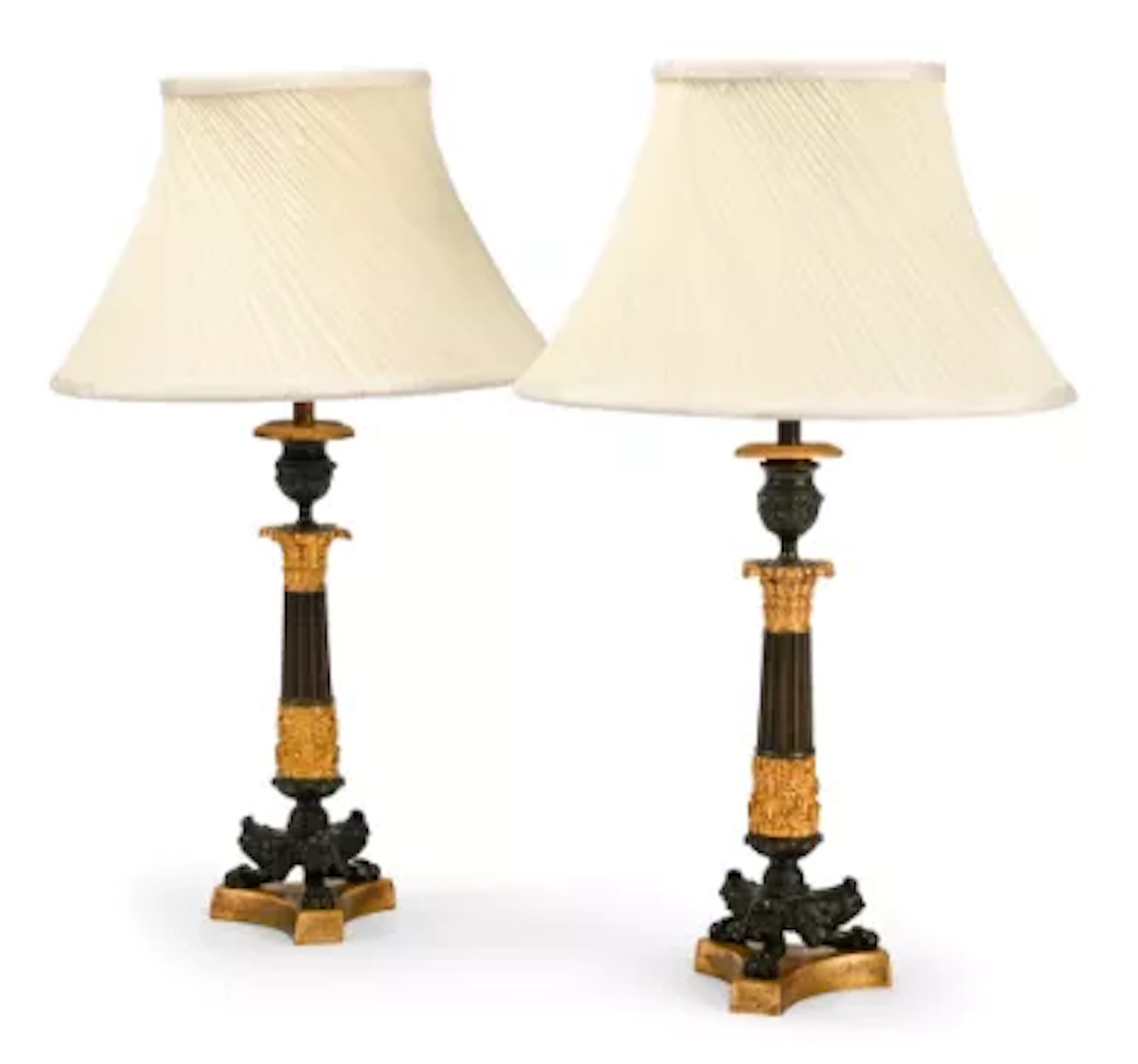 A PAIR OF GILT AND PATINATED HERCULANEUM BASE CANDLESTICK TABLE LIGHTS