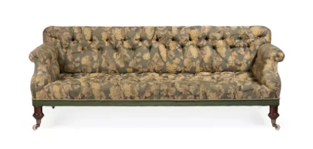 A WILLIAM IV WALNUT AND UPHOLSTERED SOFA, IN THE MANNER OF HOLLAND