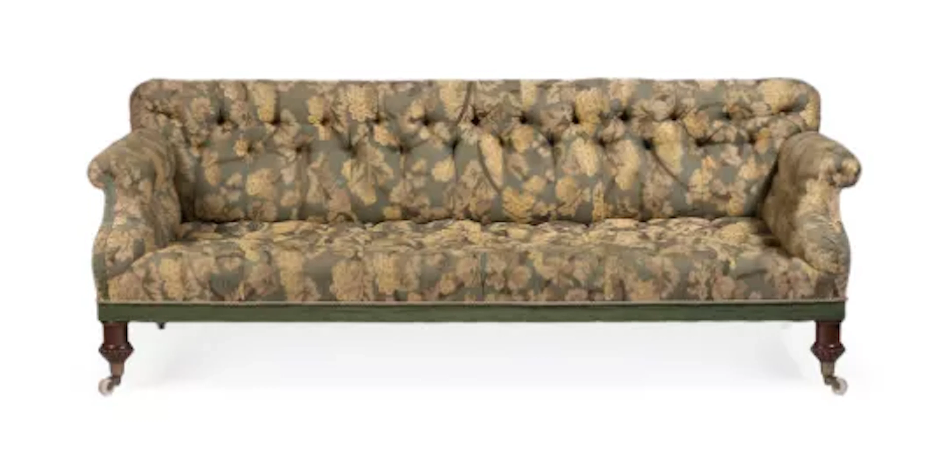 A WILLIAM IV WALNUT AND UPHOLSTERED SOFA, IN THE MANNER OF HOLLAND
