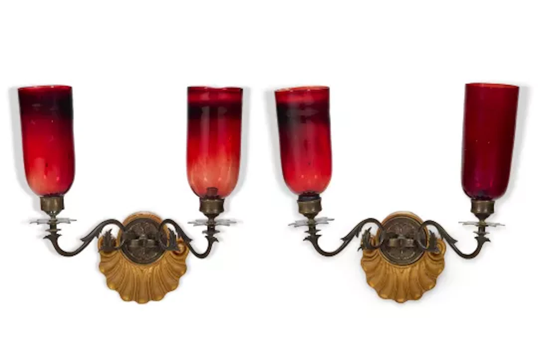 A PAIR OF GILT METAL MOUNTED CARVED GILT PAINTED WOOD, AND RED GLASS
