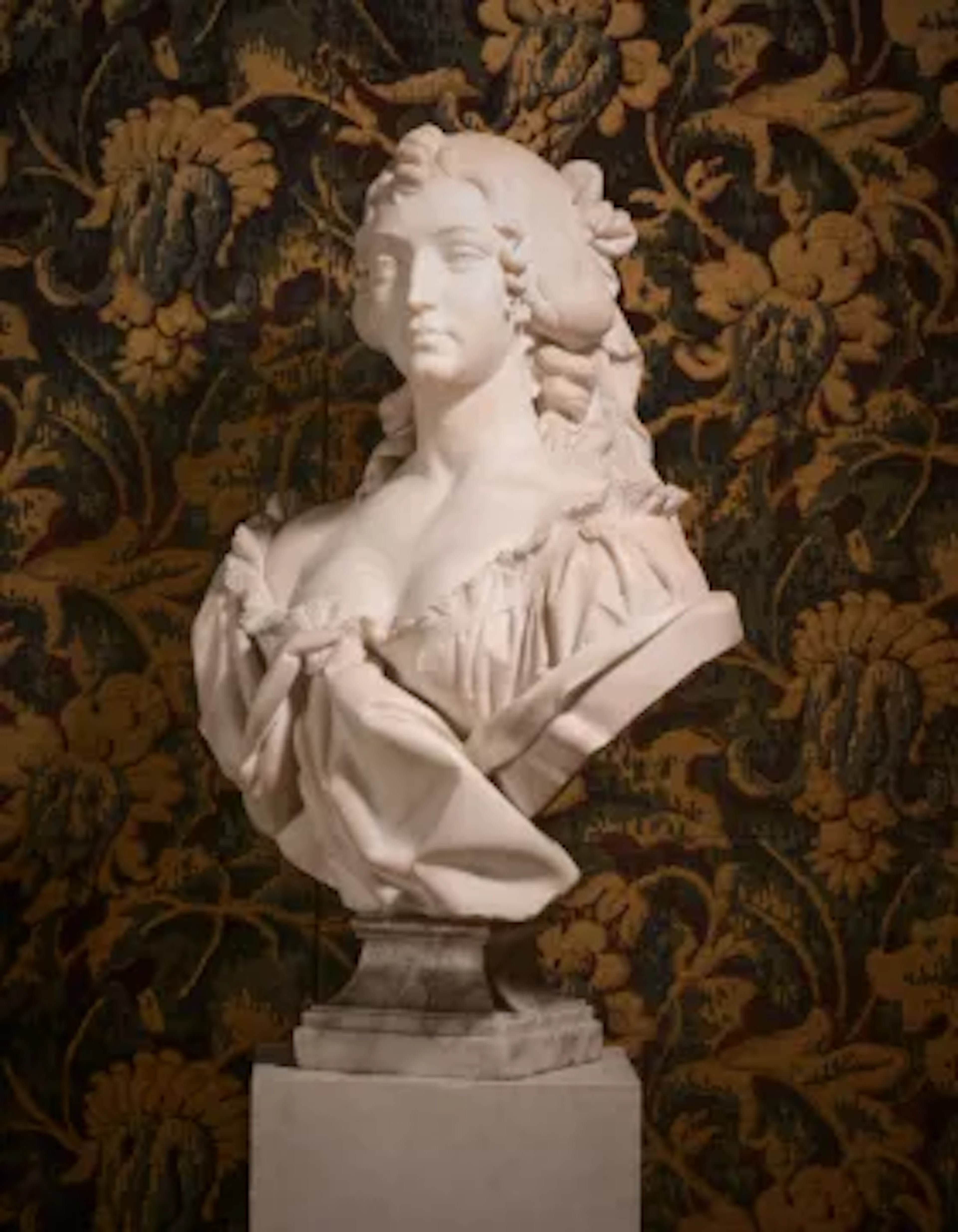 AN ITALIAN MARBLE BUST OF A YOUNG WOMAN, CIRCA 1870