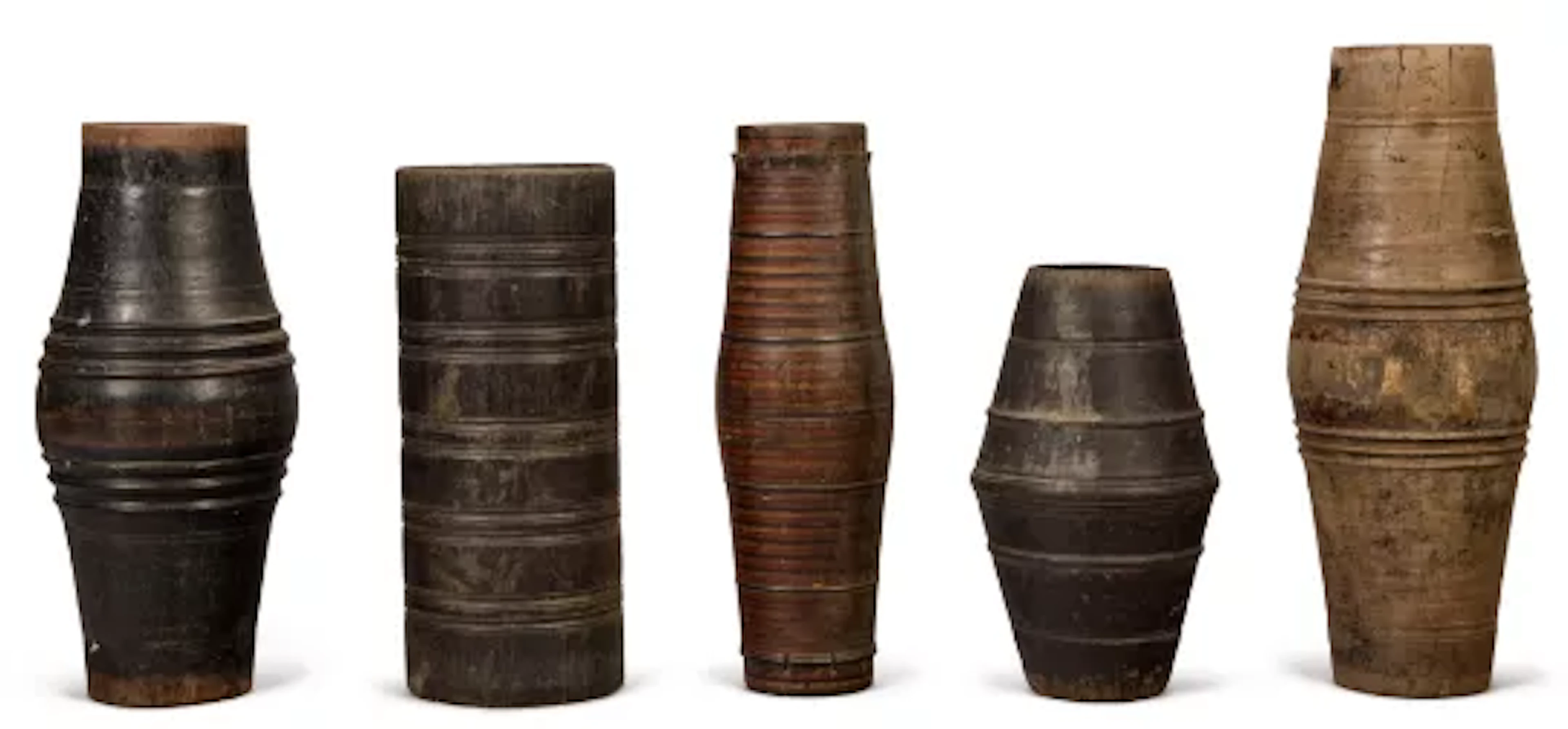 FIVE VARIOUS CARVED WOOD CEYLONESE DRUMS, 20TH CENTURY