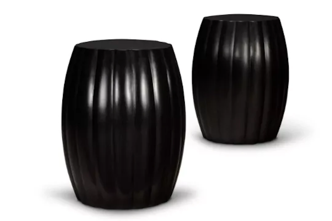 Y A PAIR OF EBONY GADROONED DRUM-SHAPED STOOLS, MODERN