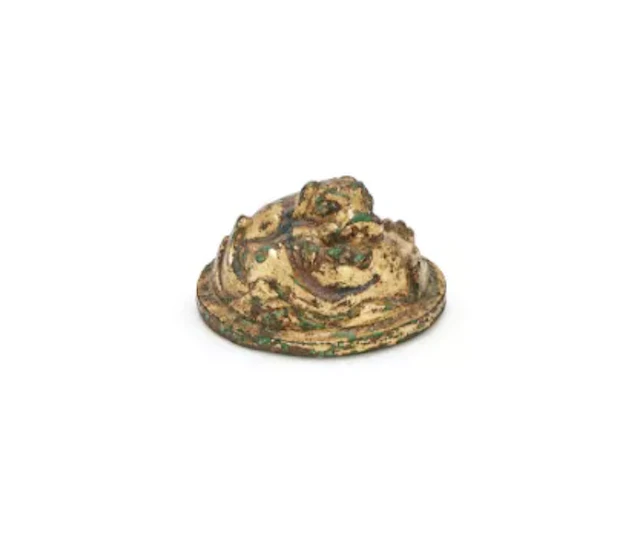 A Chinese gilt bronze paper weight, Han Dynasty (202 BC- 220 AD)