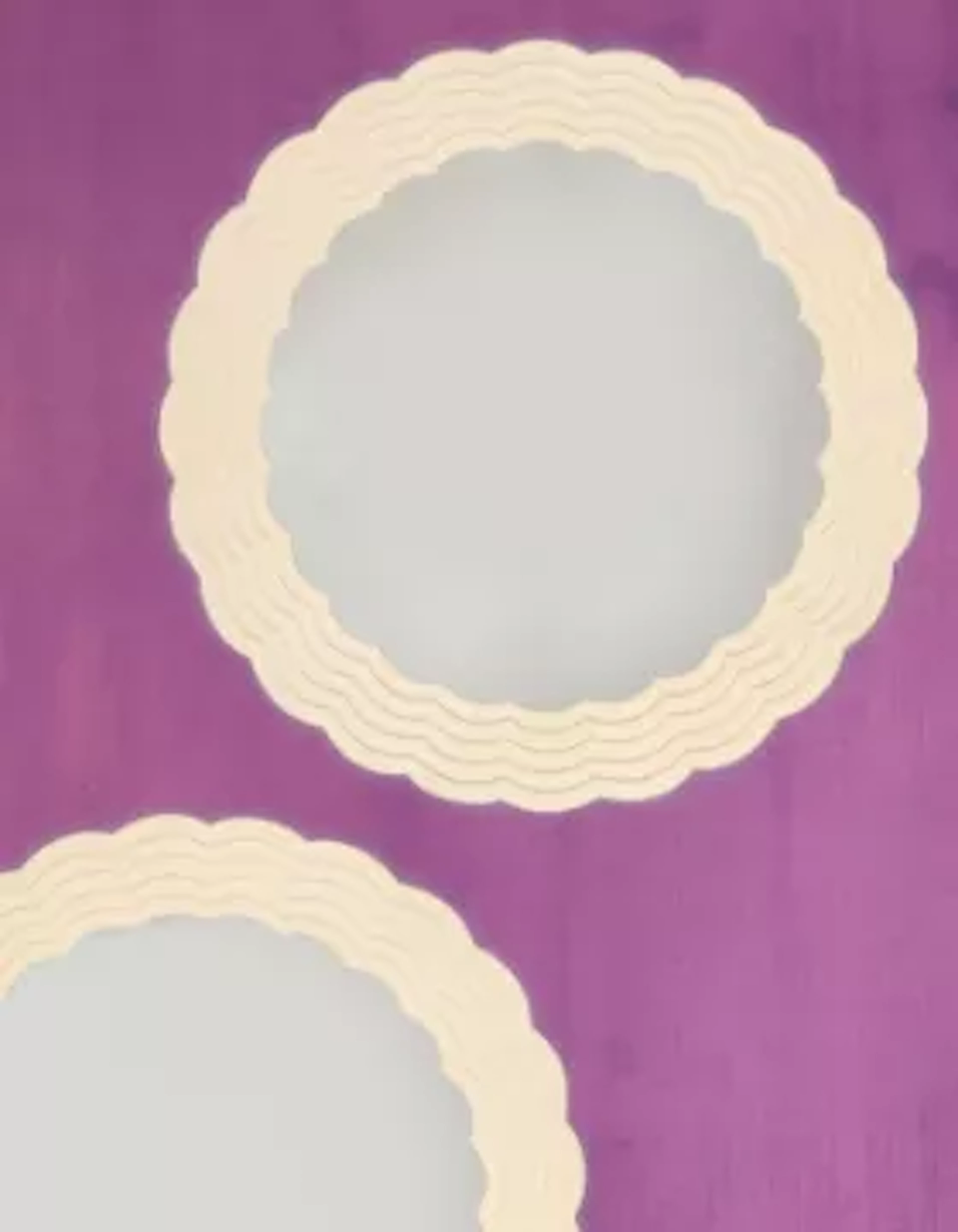A PAIR OF CREAM PAINTED TEAK 'STEPPED CLOUD' CIRCULAR MIRRORS, BY