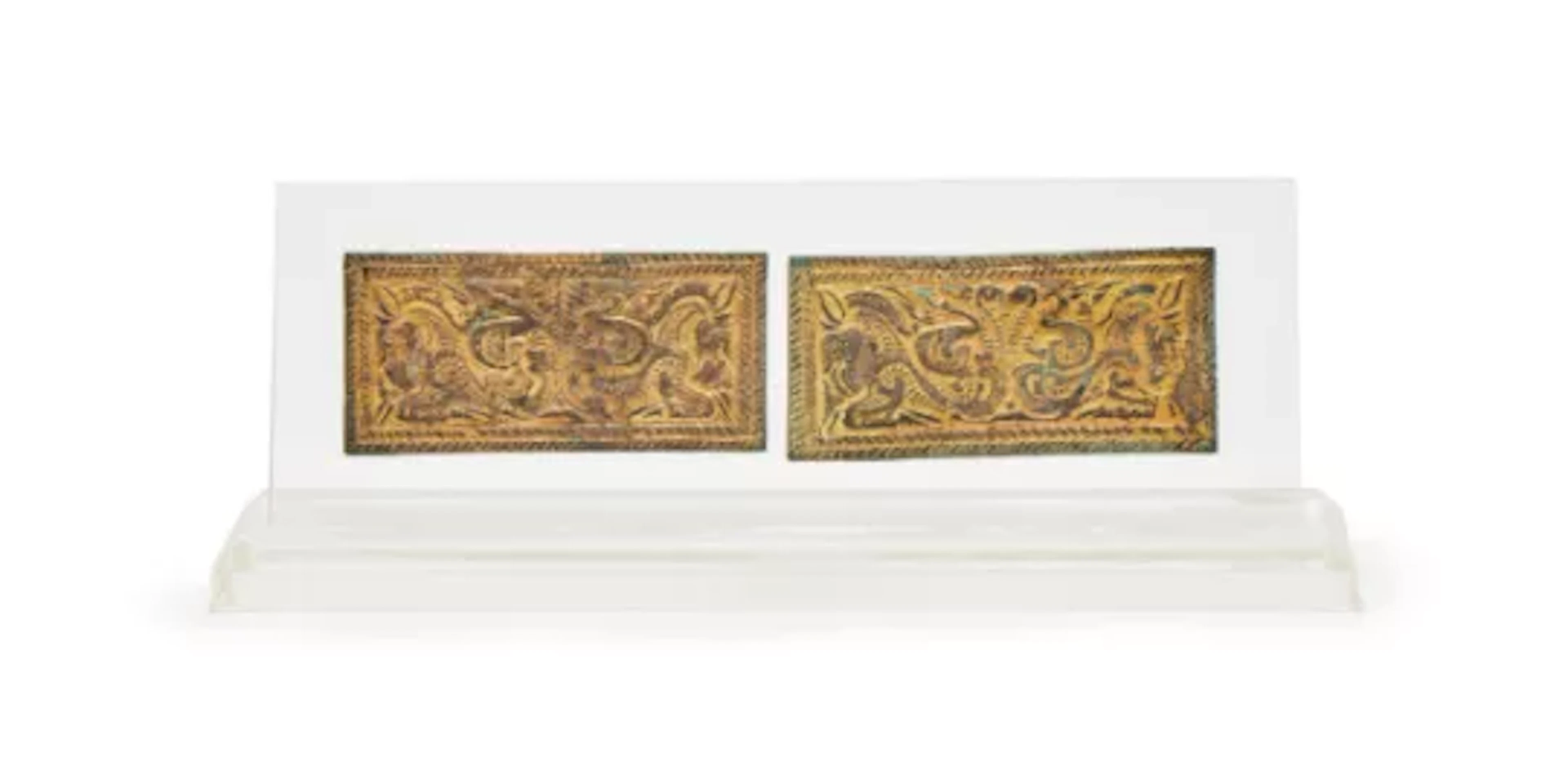 A pair of Chinese gilt bronze belt plaques, North China, 3rd-2nd century BC