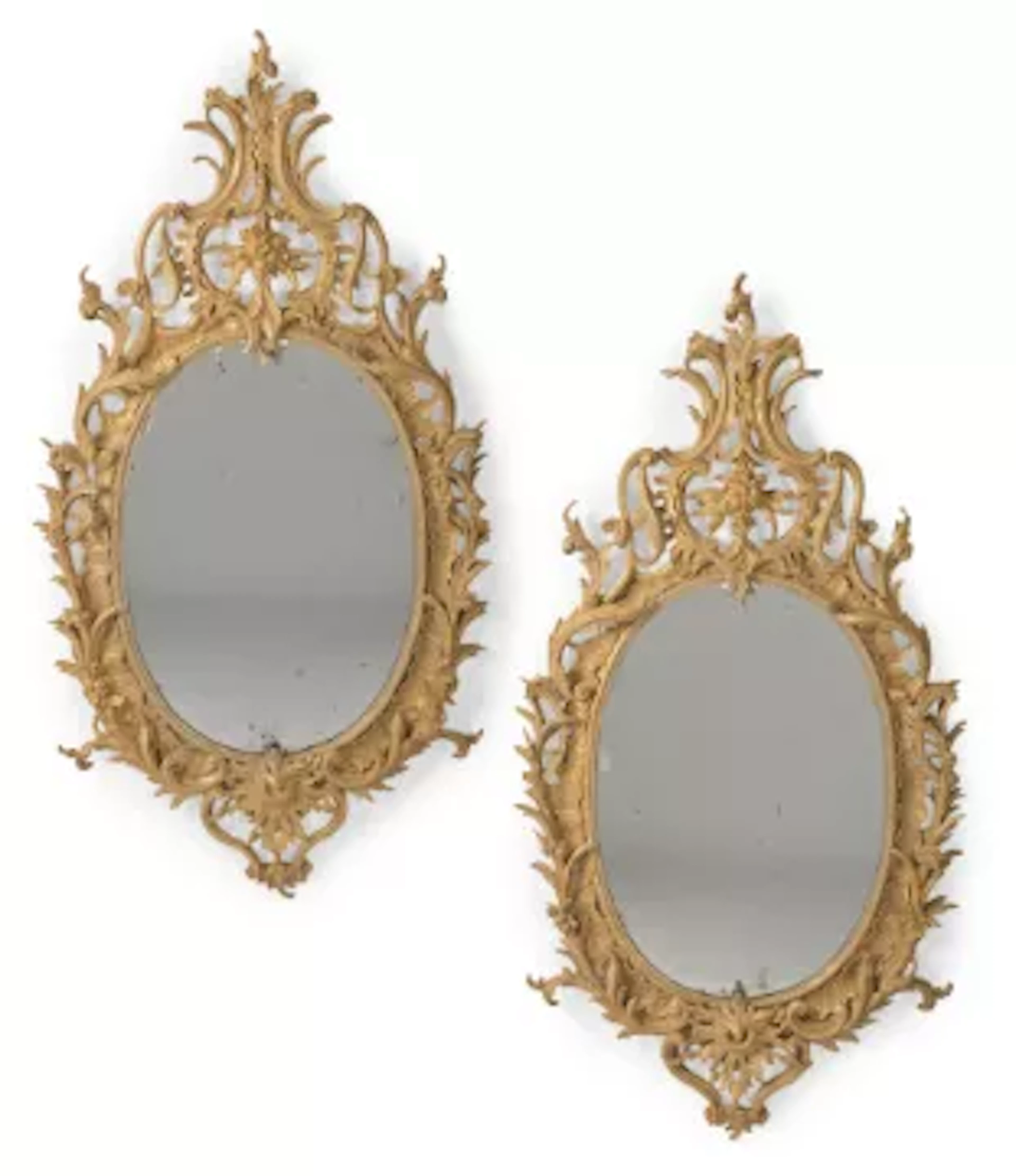 A LARGE PAIR OF CARVED GILTWOOD MIRRORS, CIRCA 1780 AND LATER
