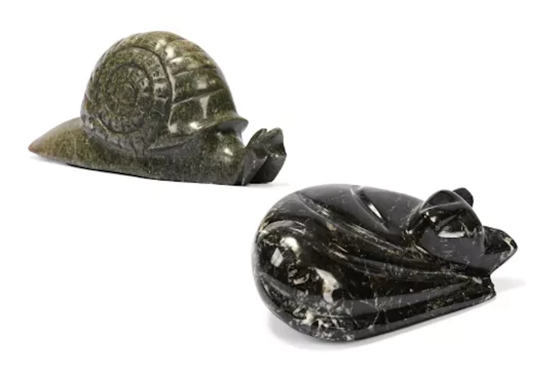 A CARVED SOAPSTONE FIGURE OF A STYLISED SNAIL, 20TH CENTURY, ALONG