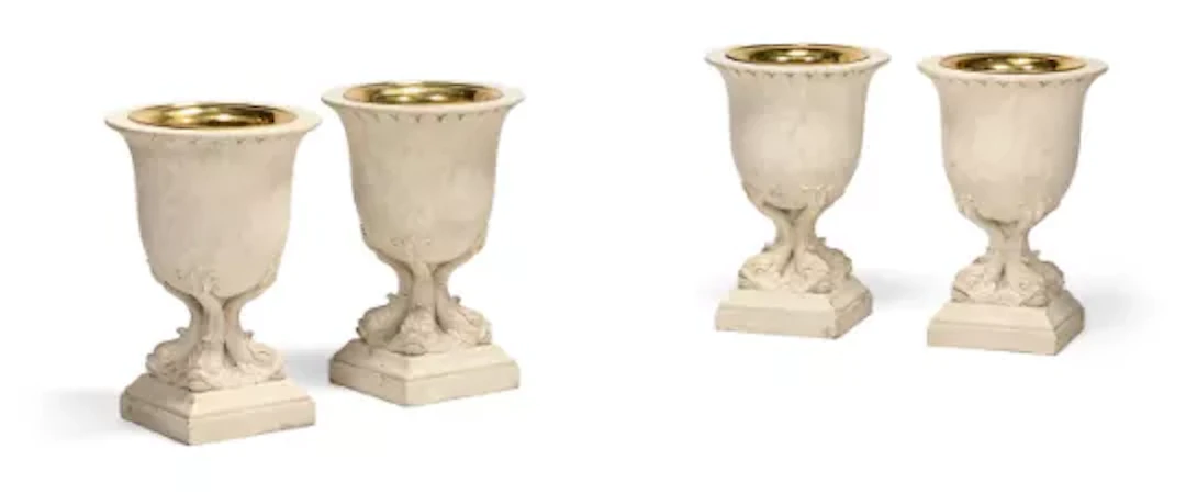 A SET OF FOUR CARVED WOOD AND GESSO PAINTED URNS OR PLANTERS, CONTEMPORARY