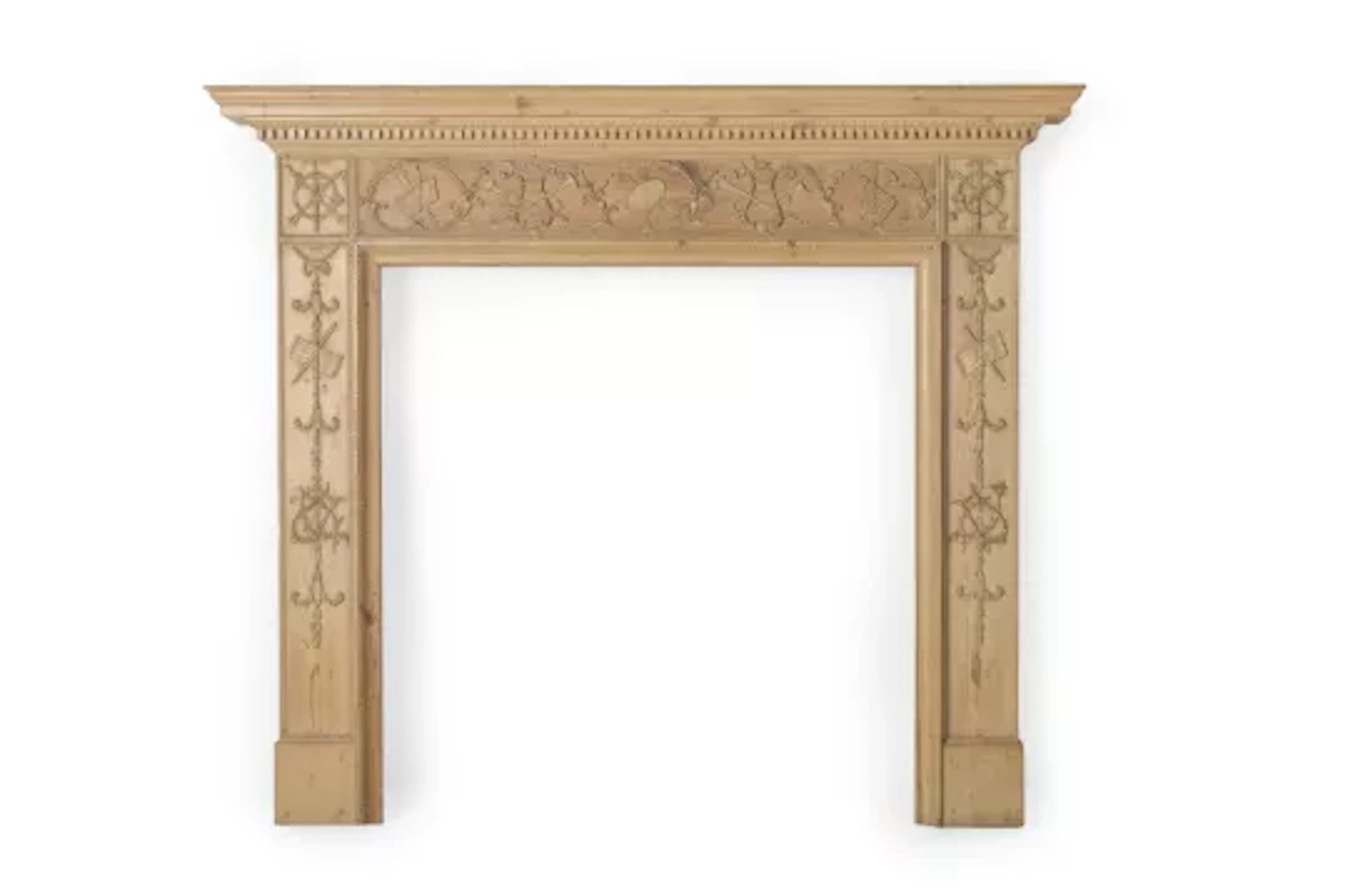 A CARVED PINE CHIMNEY PIECE OR FIRE SURROUND, LATE 18TH OR EARLY 19TH