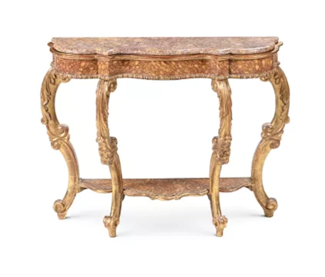 A CONTINENTAL CARVED GILTWOOD AND SIMULATED MARBLE CONSOLE TABLE