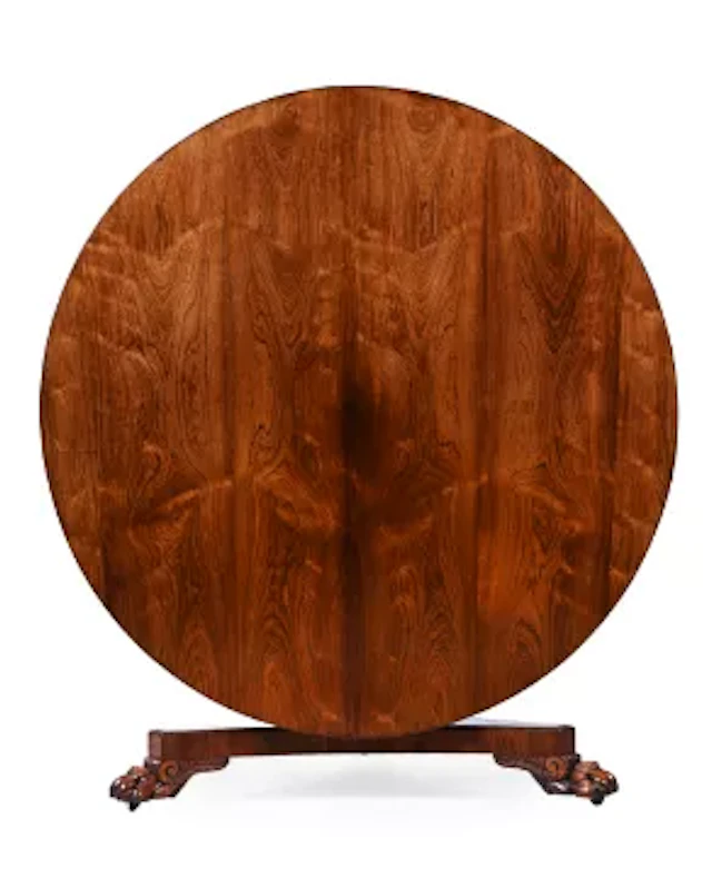 Y A REGENCY CARVED ROSEWOOD CENTRE OR DINING TABLE, IN THE MANNER