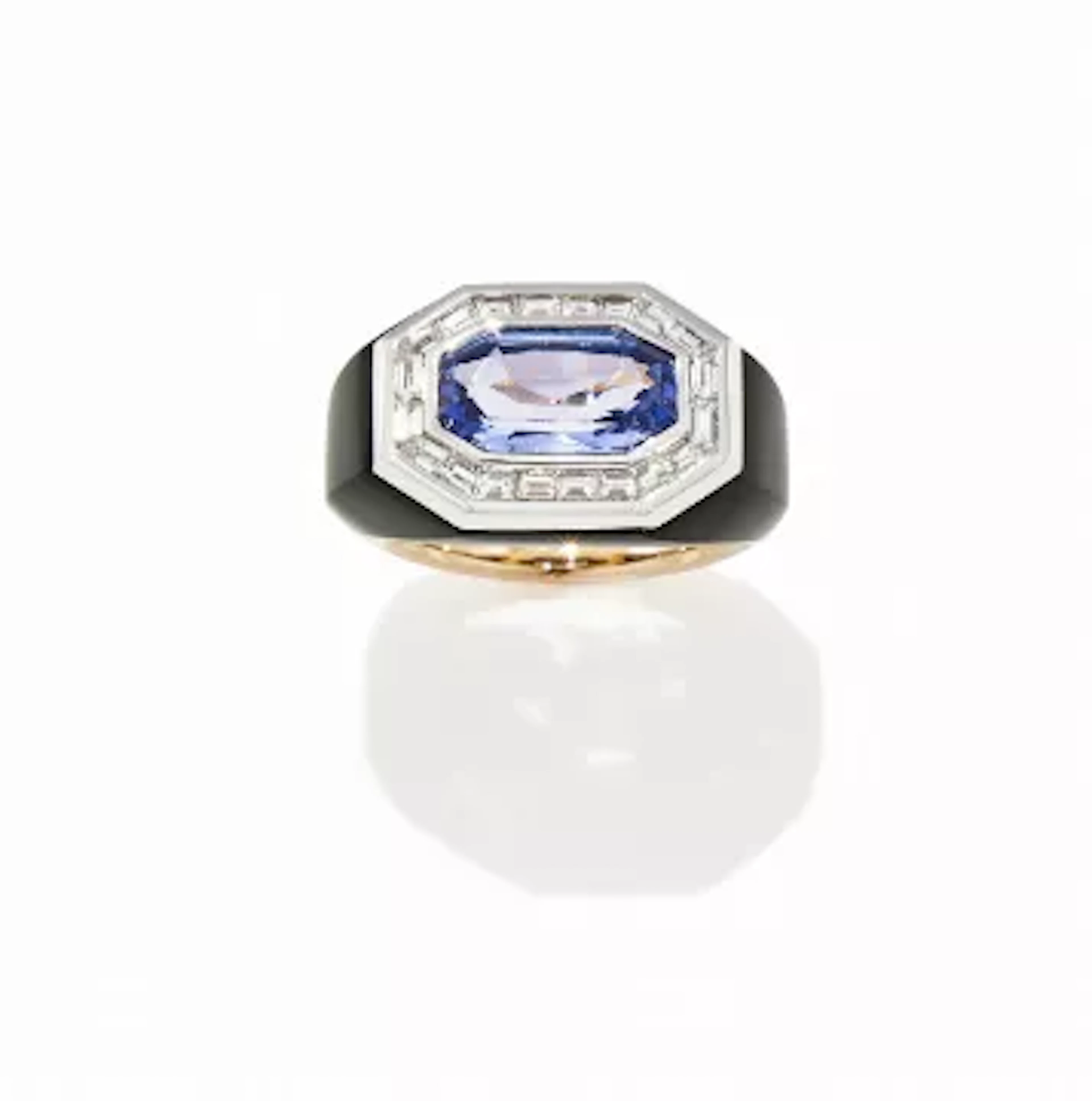 A TANZANITE, ONYX AND DIAMOND DRESS RING