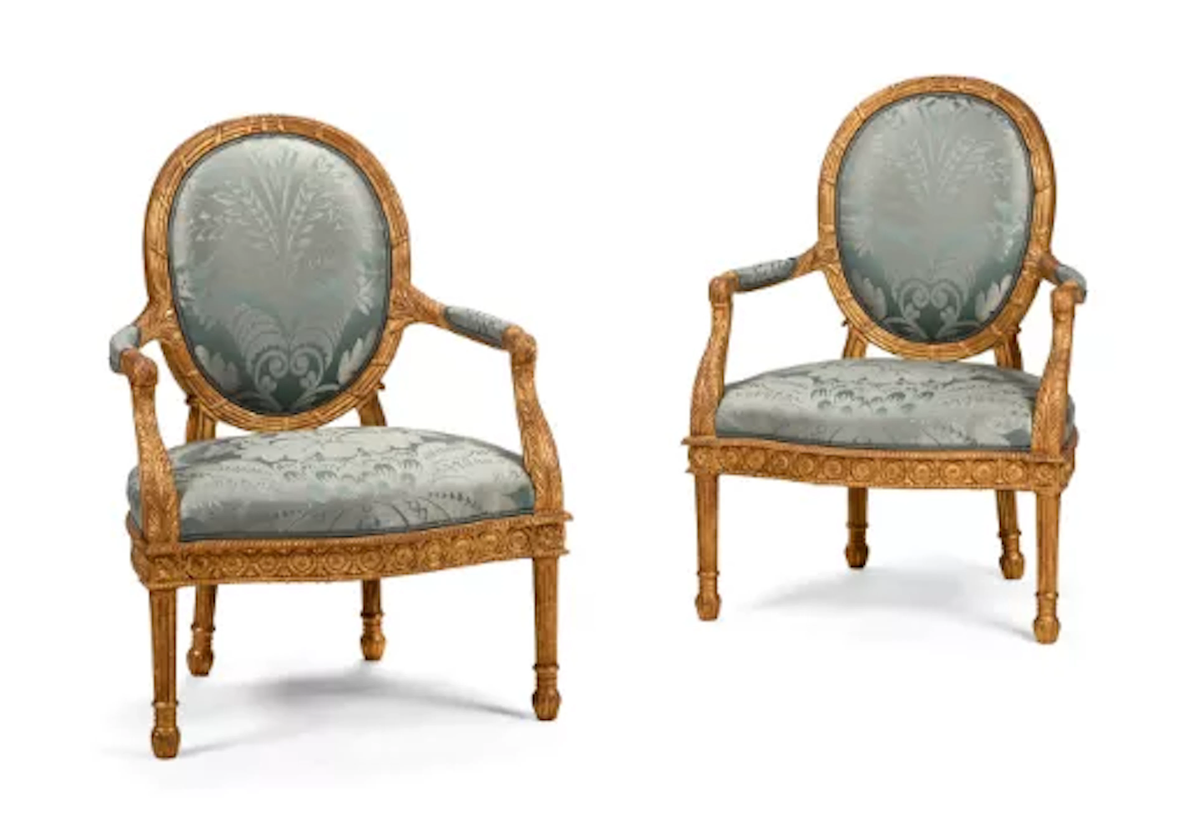 A PAIR OF CARVED GILTWOOD AND UPHOLSTERED ARMCHAIRS, AFTER A DESIGN
