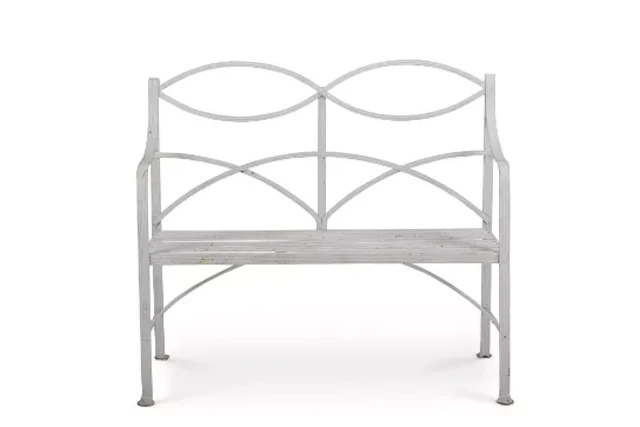 A WHITE PAINTED WROUGHT IRON GARDEN BENCH IN THE REGENCY STYLE, EARLY