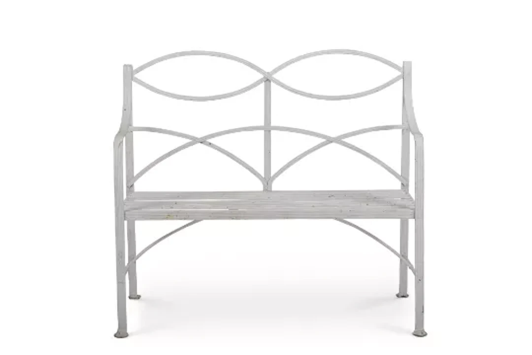 A WHITE PAINTED WROUGHT IRON GARDEN BENCH IN THE REGENCY STYLE, EARLY