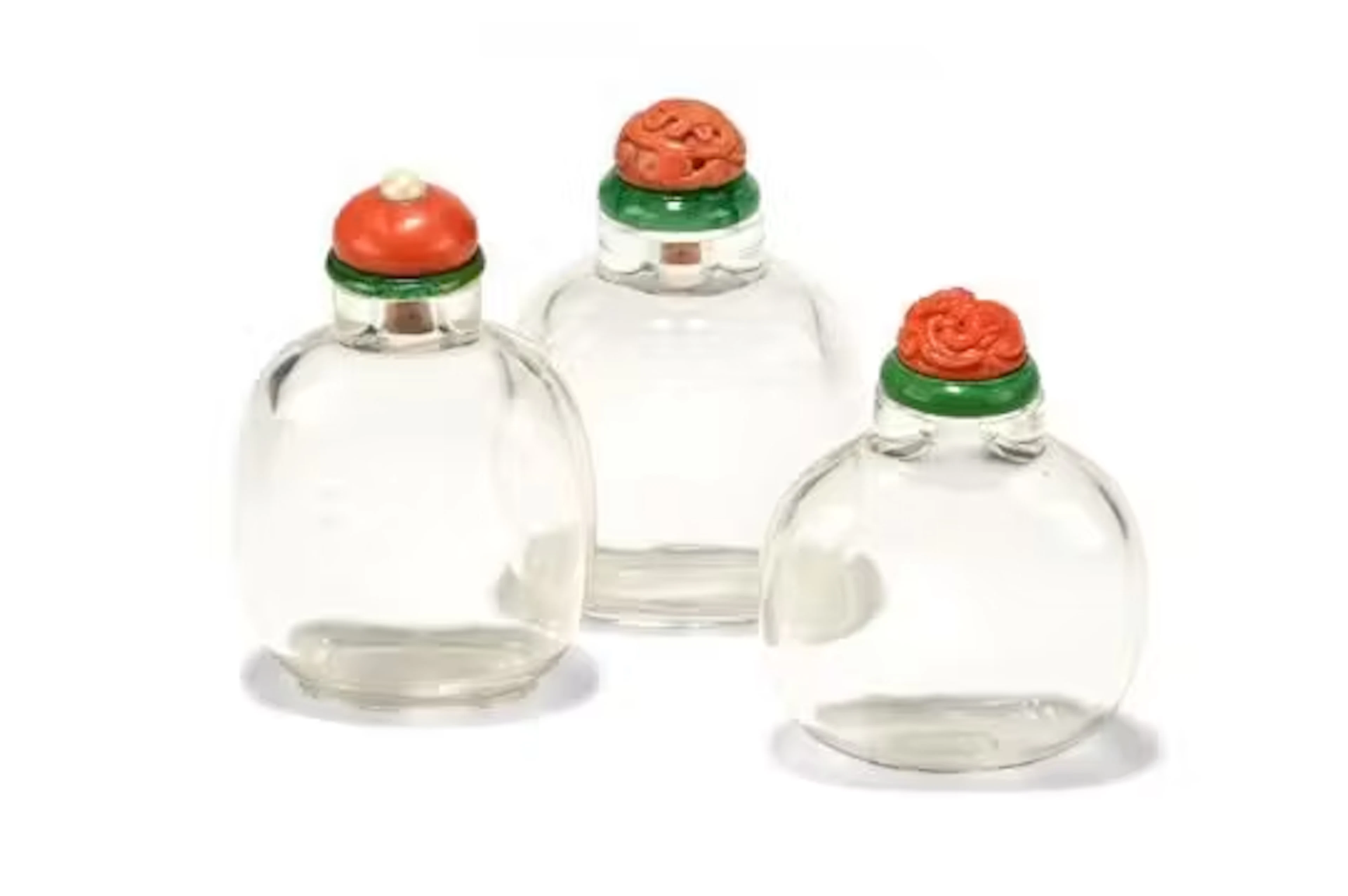 Y A group of three Chinese rock crystal snuff bottles