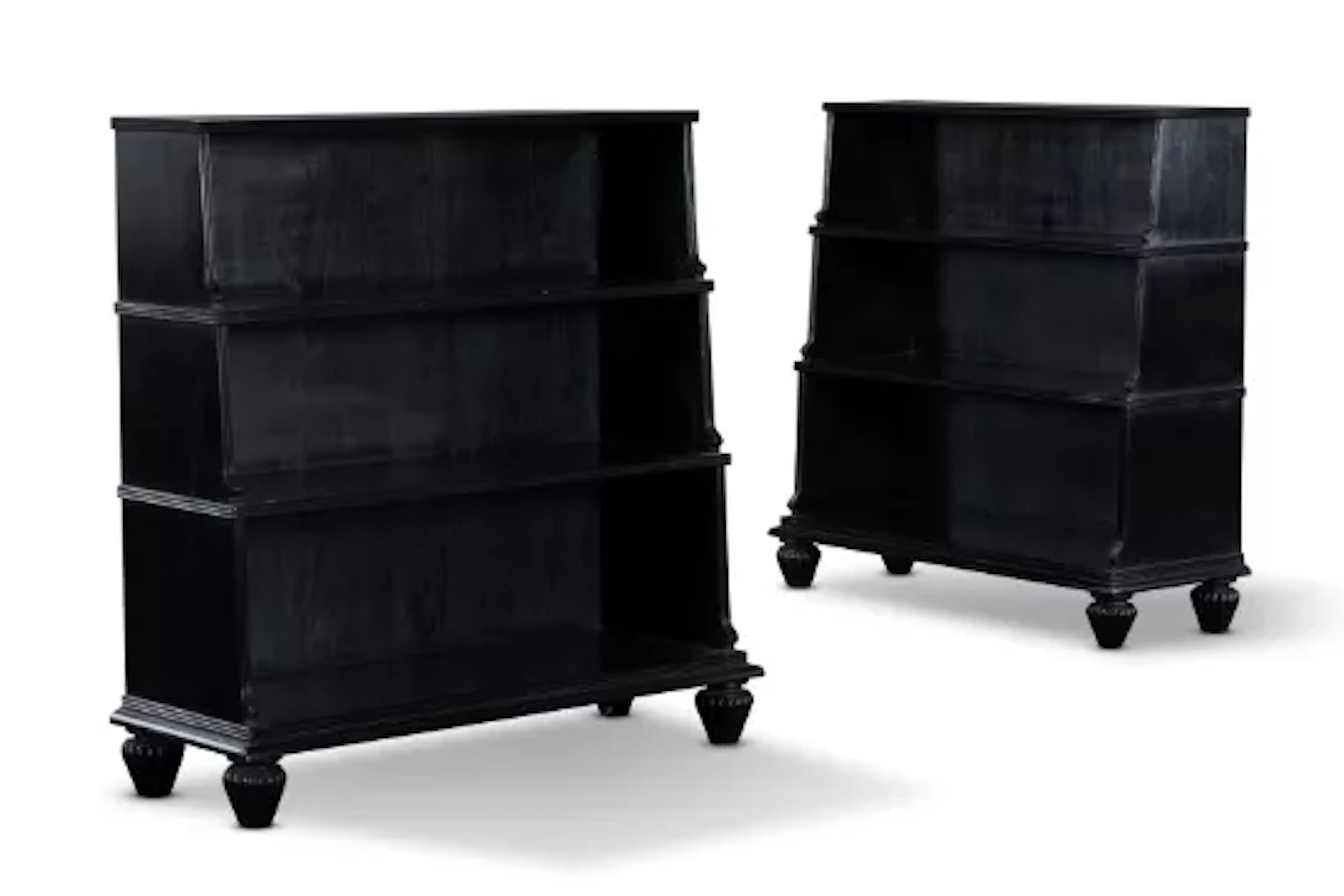 A PAIR OF EBONISED HARDWOOD 'WATERFALL' OPEN BOOKCASES, INDIAN, MODERN