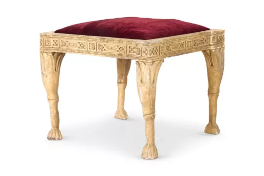 AN OCHRE PAINTED `EGYPTIAN REVIVAL' STOOL, INDIAN, EARLY 20TH CENTURY