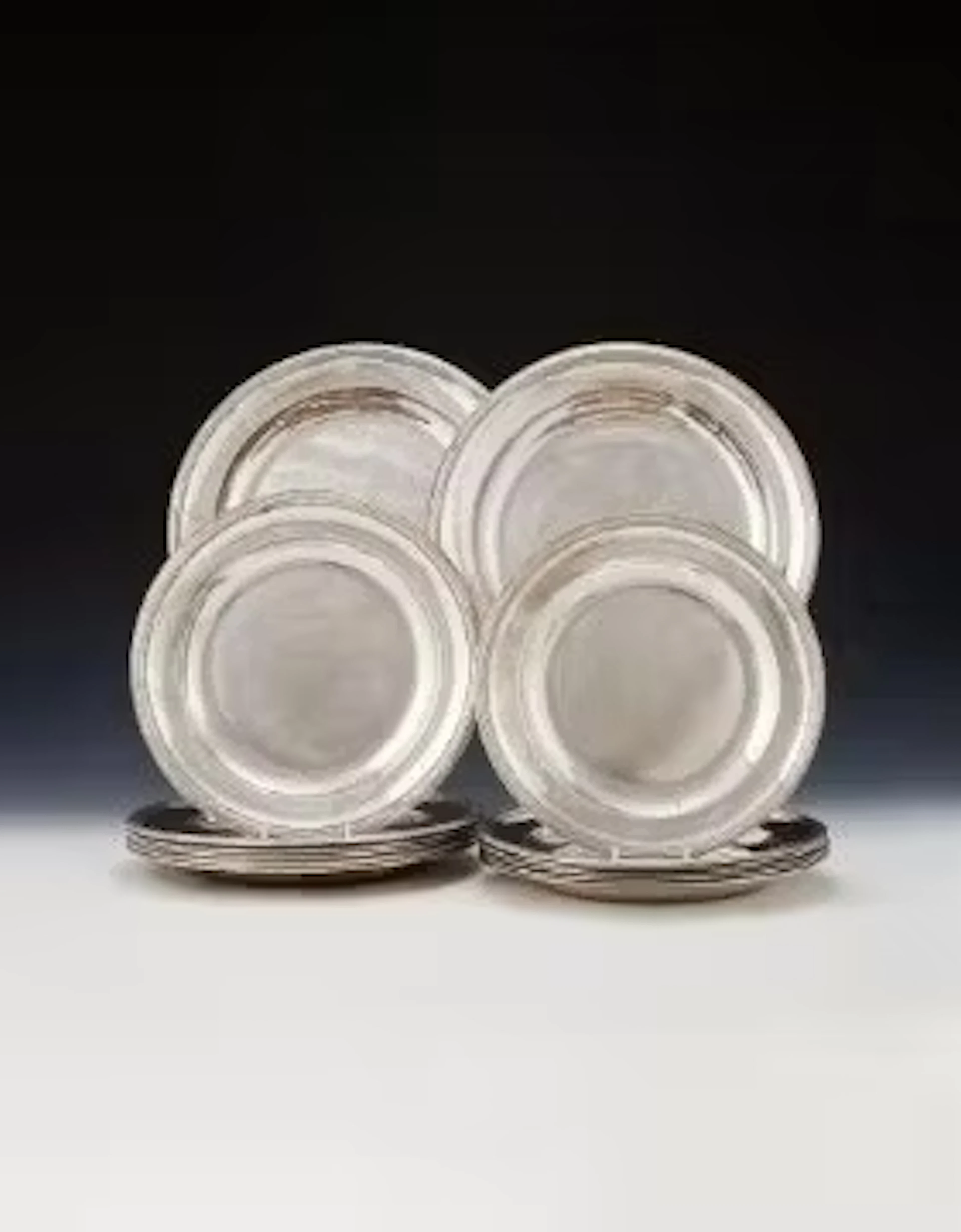 A SET OF FOURTEEN FRENCH EMPIRE SILVER PLATES