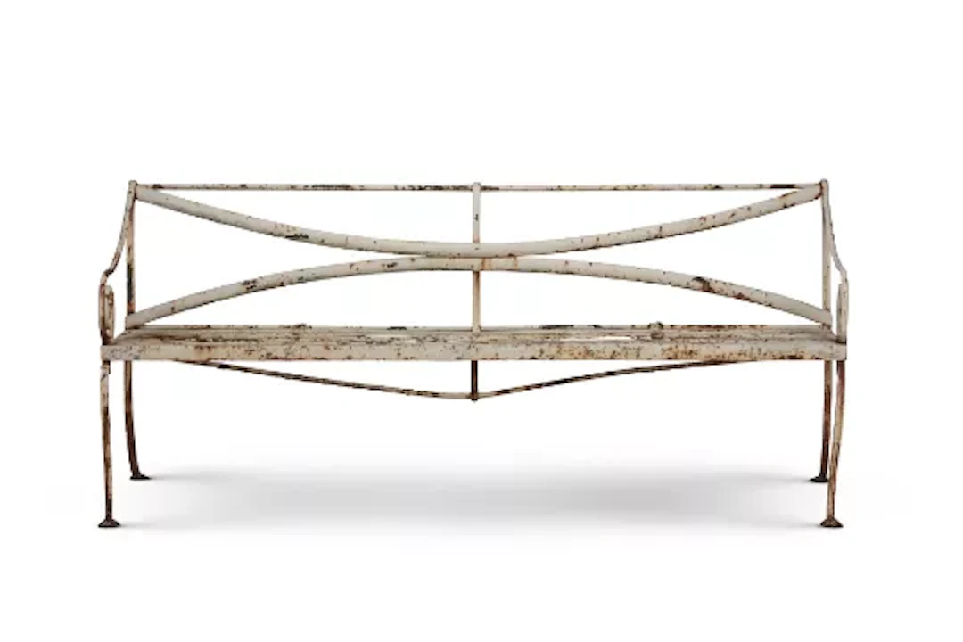 A WHITE PAINTED WROUGHT IRON GARDEN BENCH IN THE REGENCY STYLE, EARLY