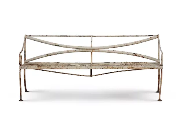 A WHITE PAINTED WROUGHT IRON GARDEN BENCH IN THE REGENCY STYLE, EARLY