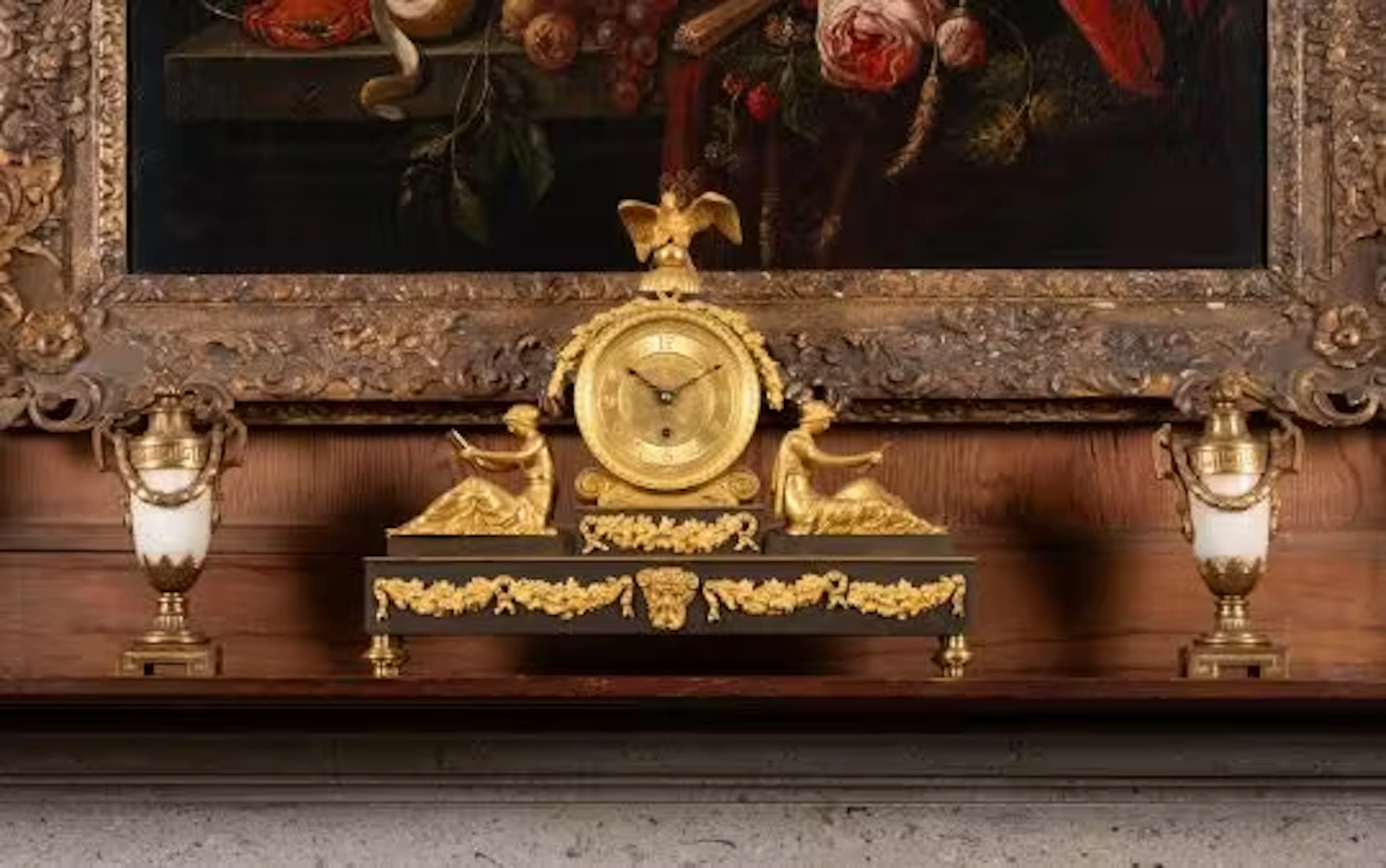 A GILT AND PATINATED BRONZE MANTEL TIMEPIECE, 19TH CENTURY