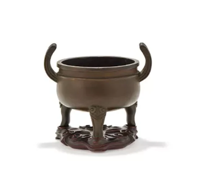 A Chinese bronze tripod censer