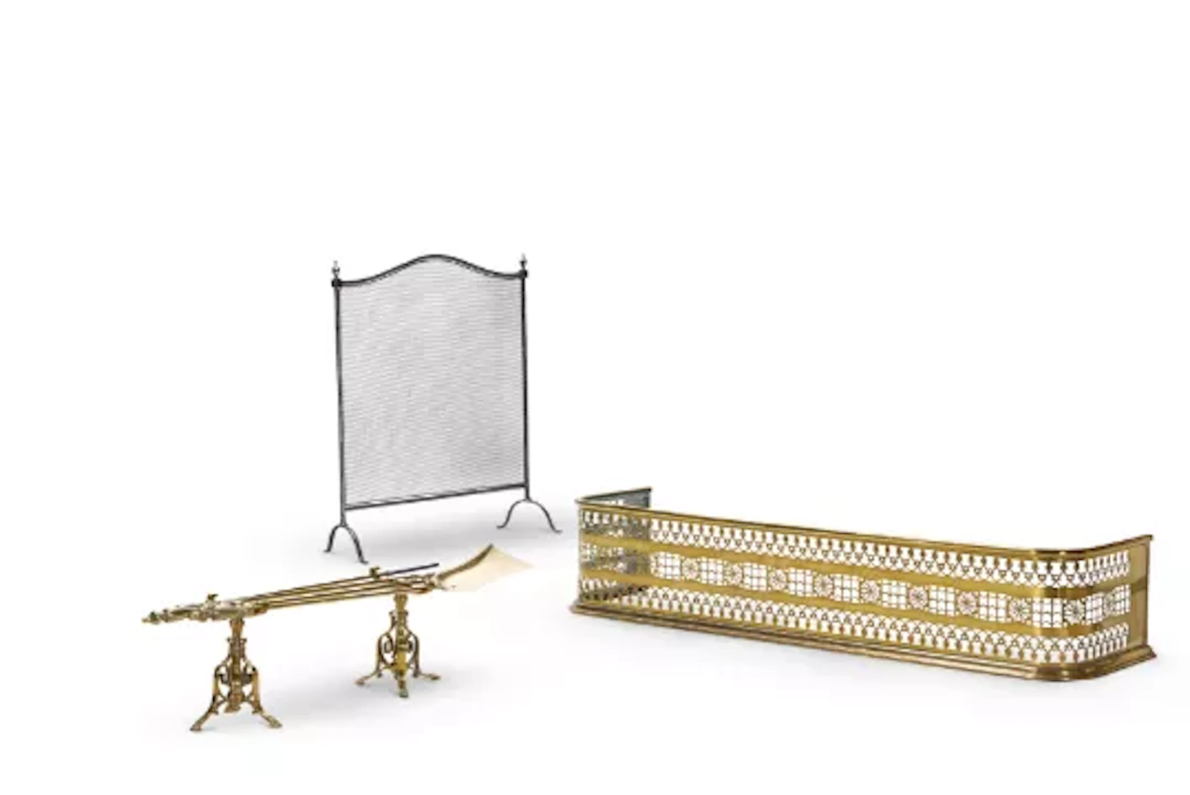 A REGENCY PIERCED BRASS FENDER, EARLY 19TH CENTURY, TOGETHER WITH