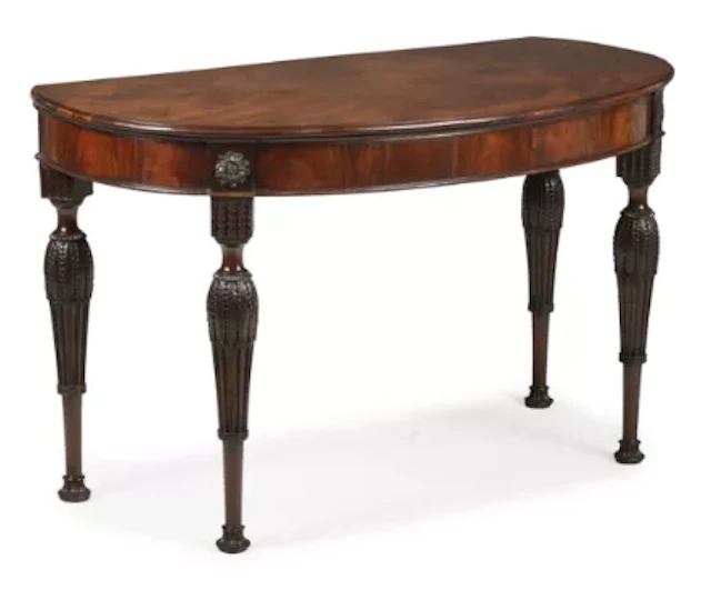 † A FINE AND UNUSUAL GEORGE III MAHOGANY SEMI ELLIPTICAL CONSOLE OR