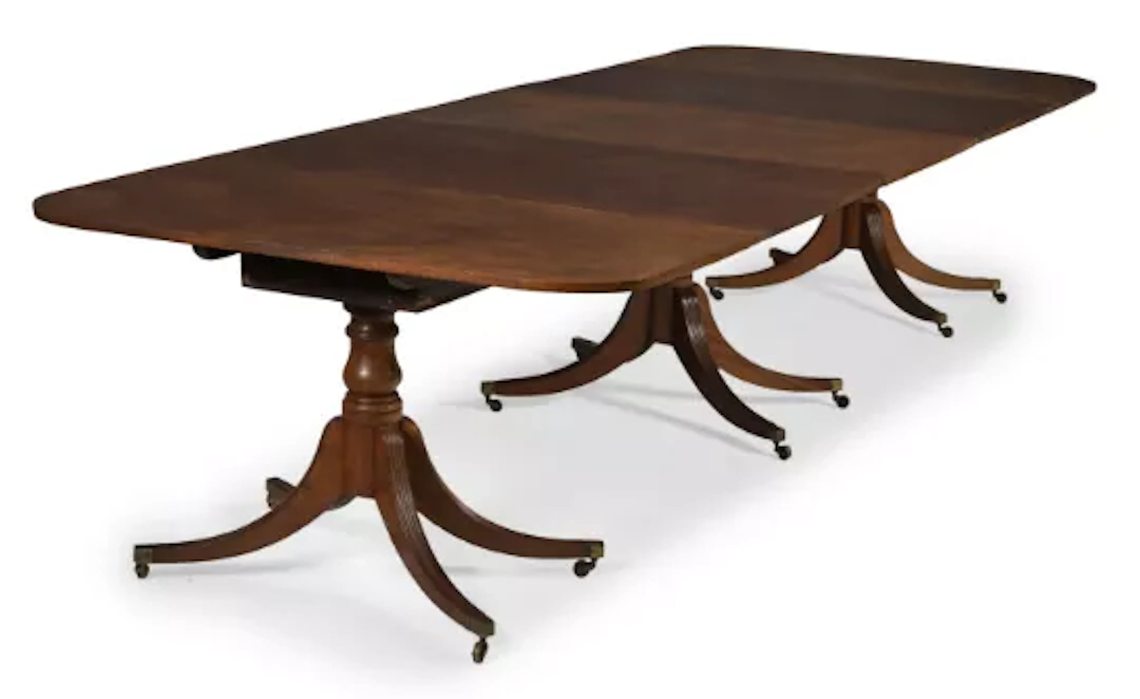 A REGENCY MAHOGANY TRIPLE PEDESTAL EXTENDING DINING TABLE, CIRCA 1815