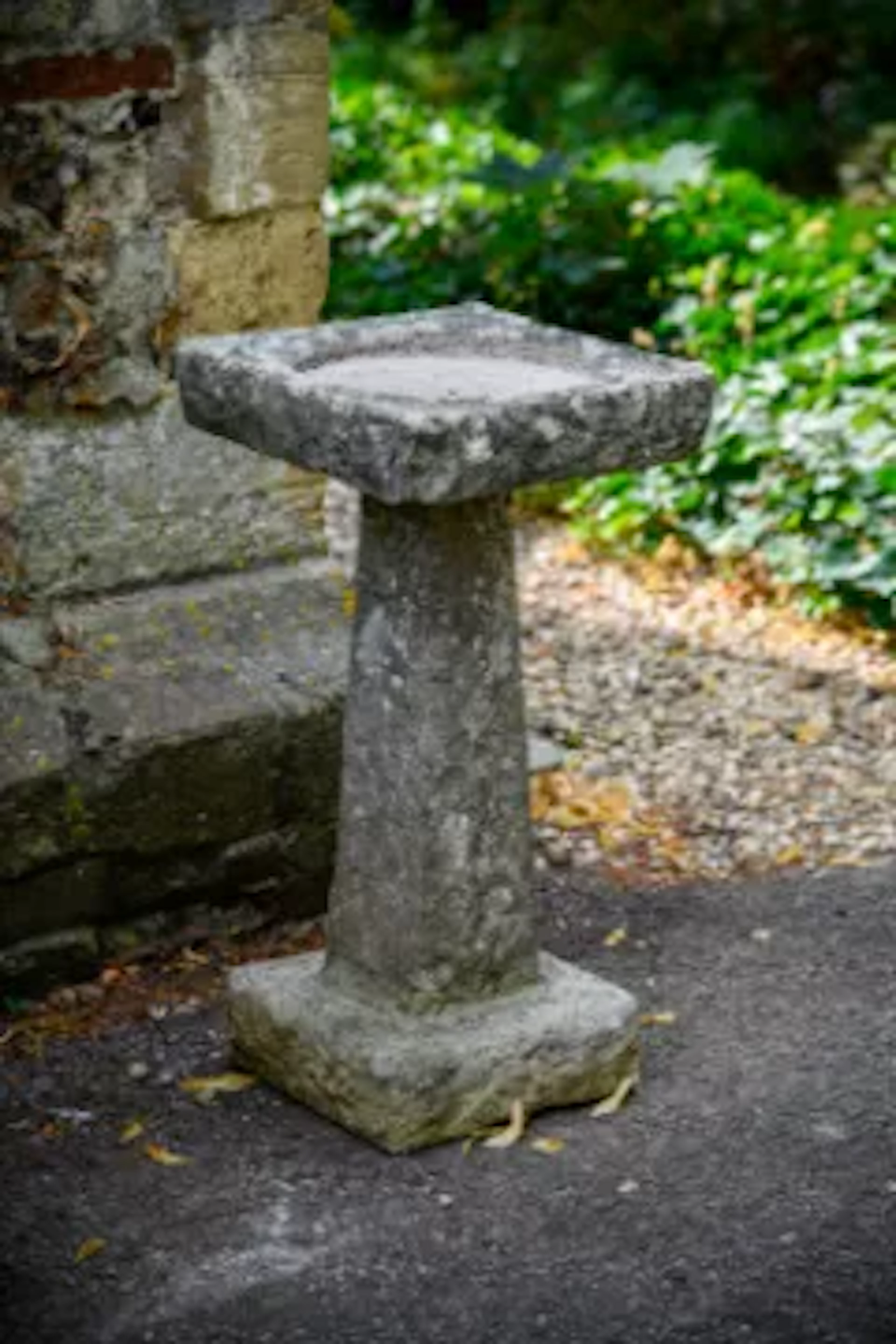 A LATE GEORGE III CARVED LIMESTONE BIRDBATH, EARLY 19TH CENTURY