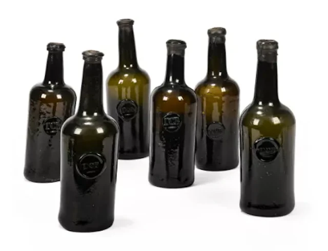 A SET OF SIX LATE BRISTOL GREEN GLASS WINE BOTTLES, 18TH CENTURY