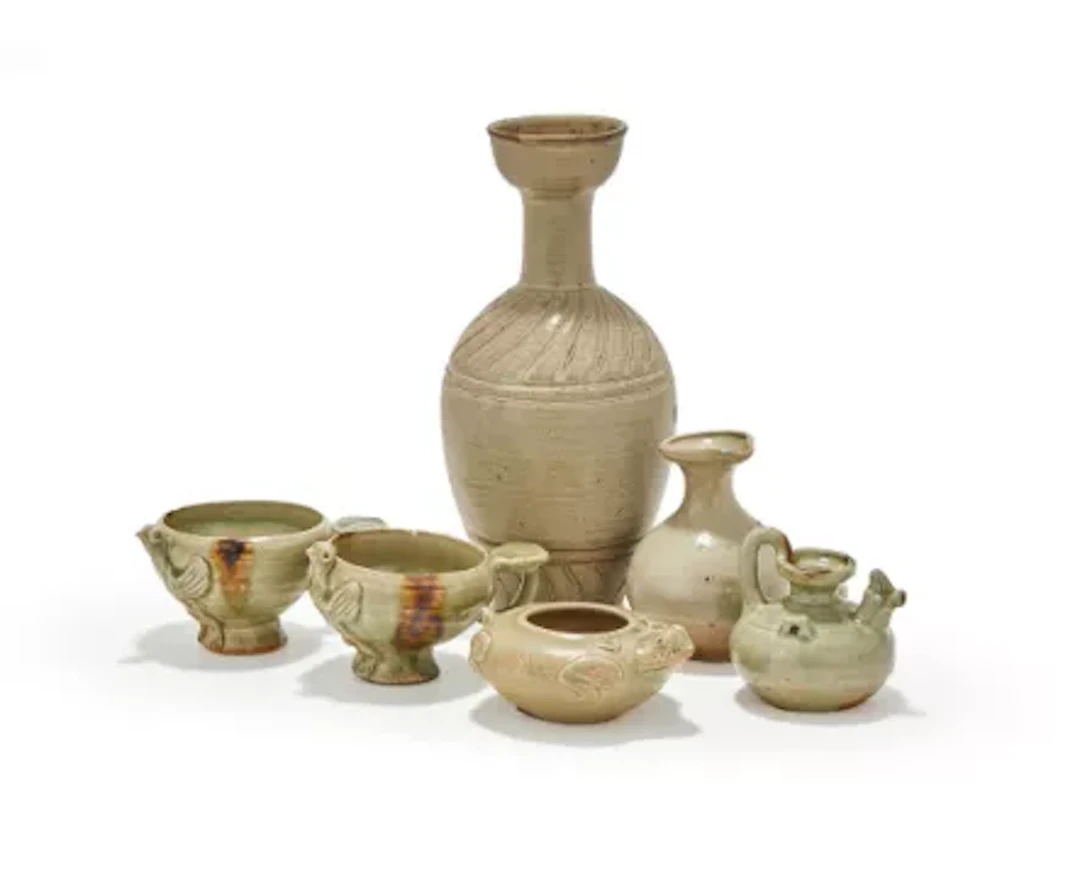 A group of assorted Chinese celadon water droppers and vases, 10th