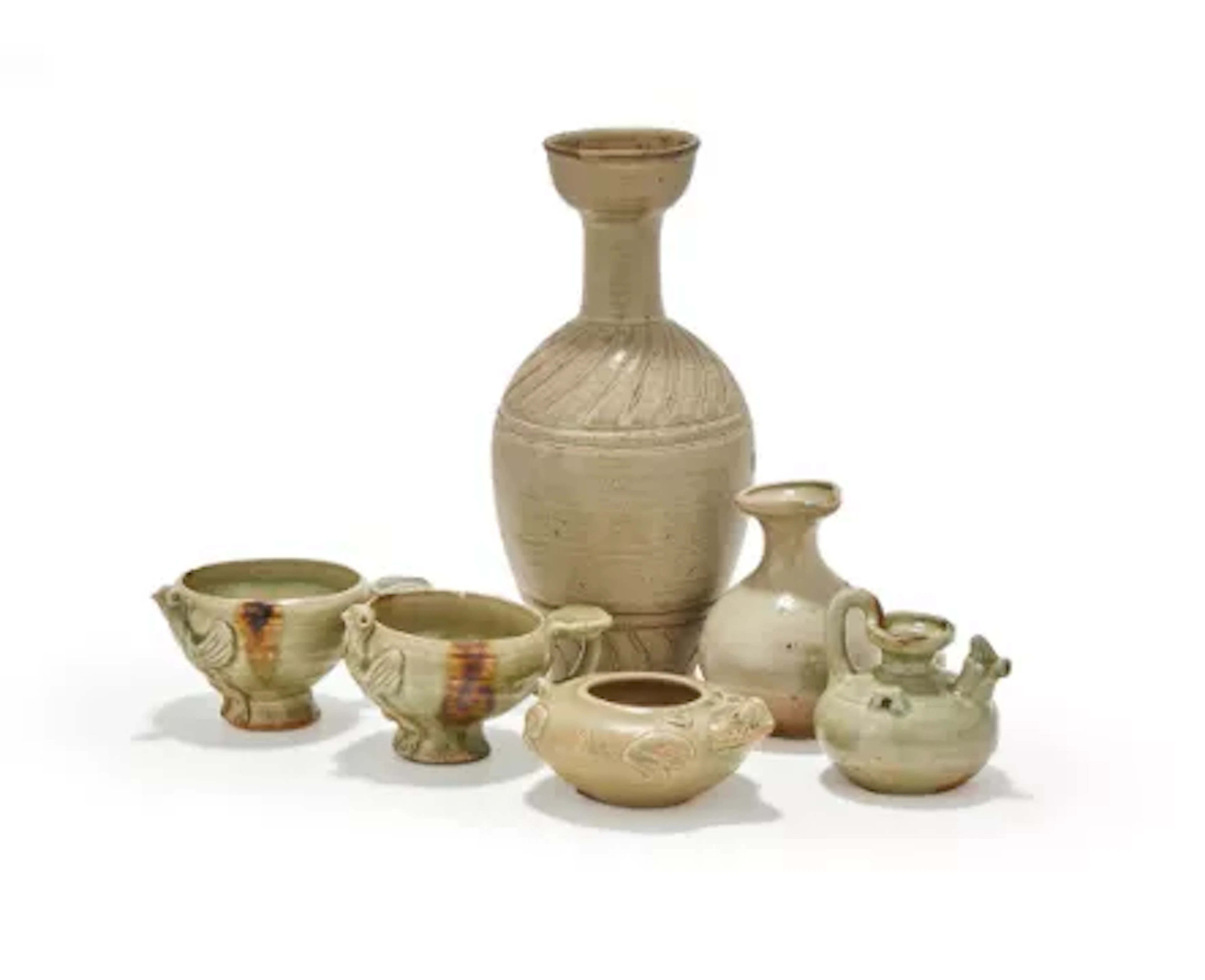 A group of assorted Chinese celadon water droppers and vases, 10th