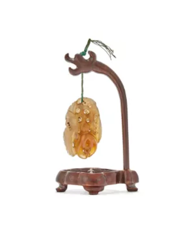 A Chinese carved Suzhou agate pendant, 18th century