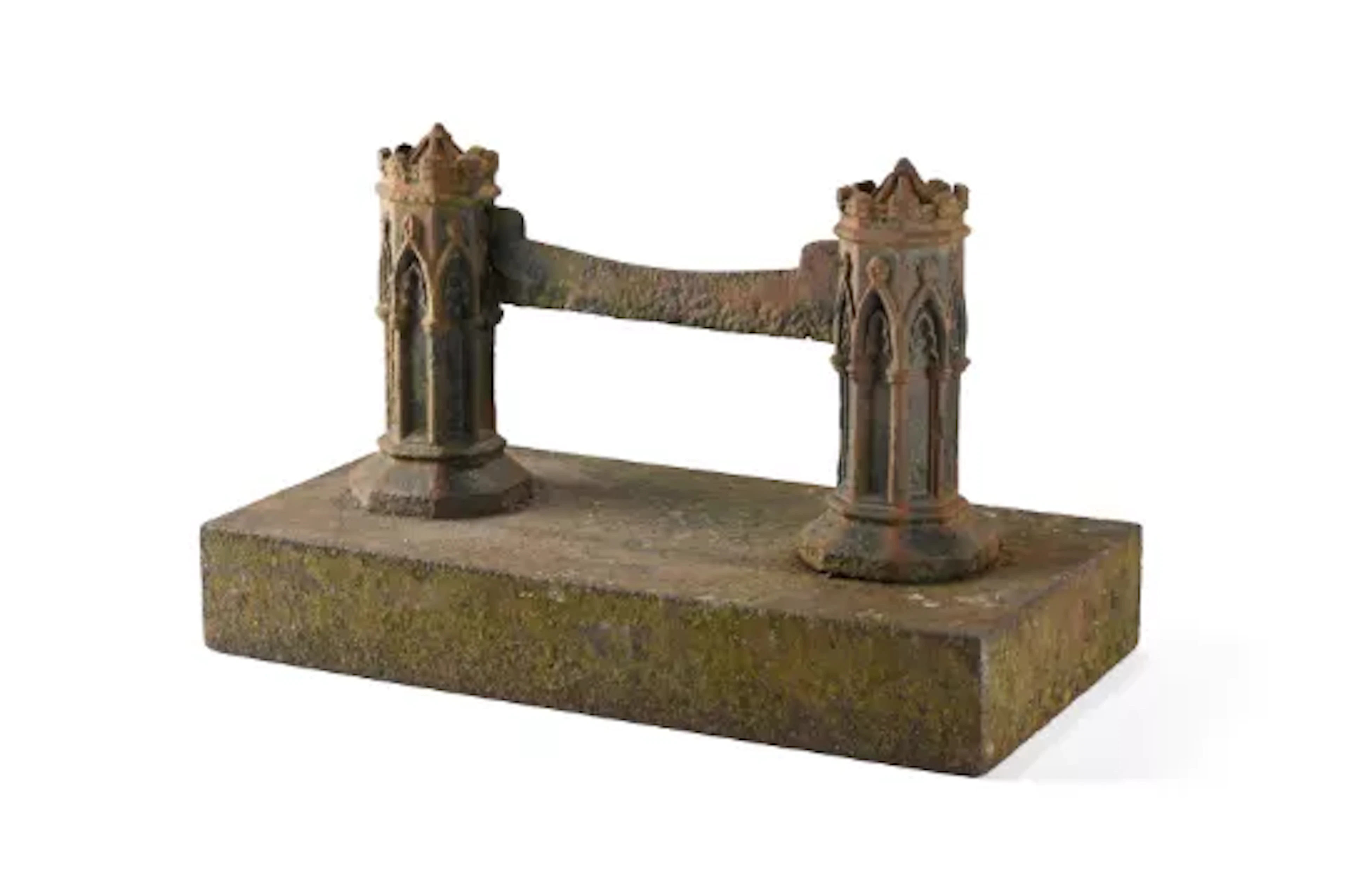 A LARGE GOTHIC ARCHITECTURAL CAST IRON BOOT SCRAPER, IN THE MANNER