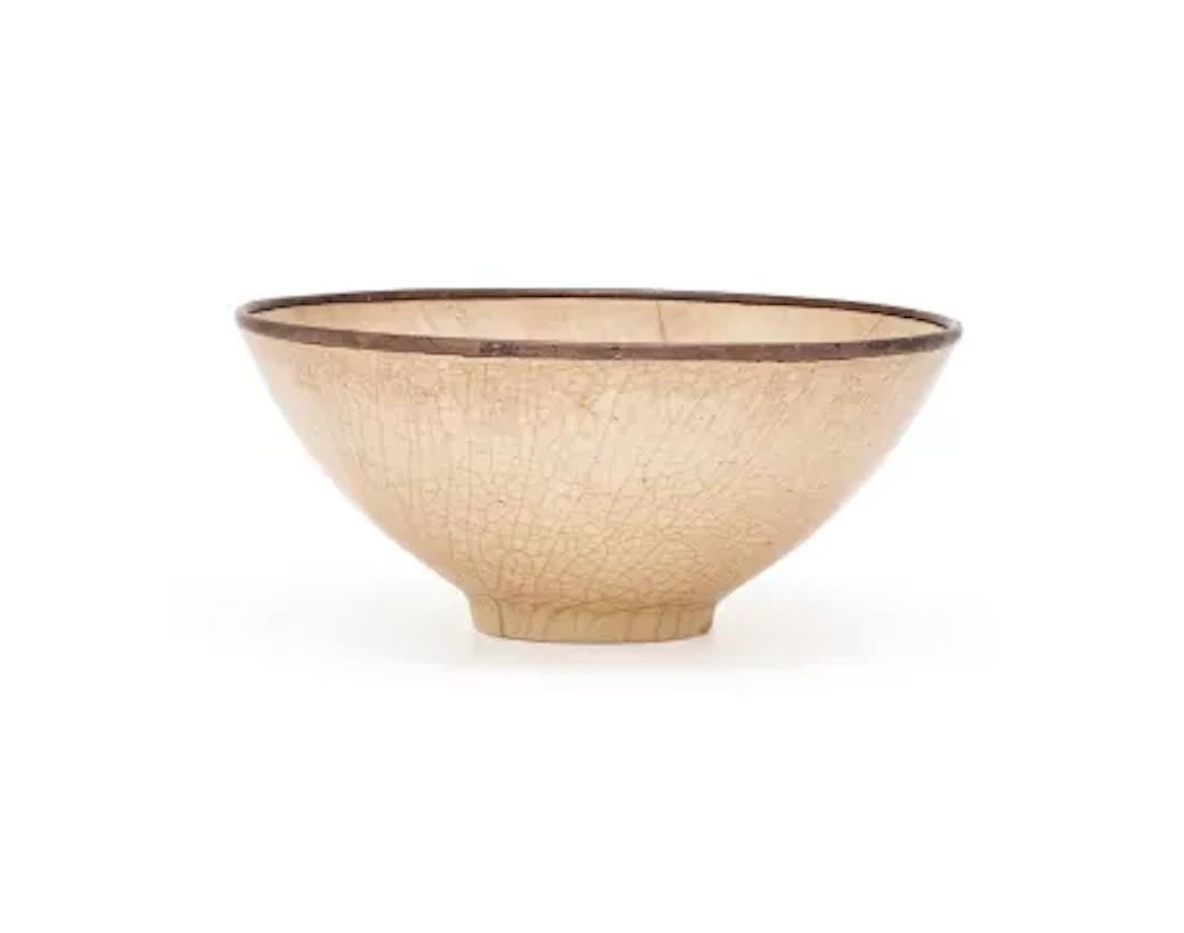 A Chinese soft-paste Ding type 'Lotus' bowl, Ming Dynasty