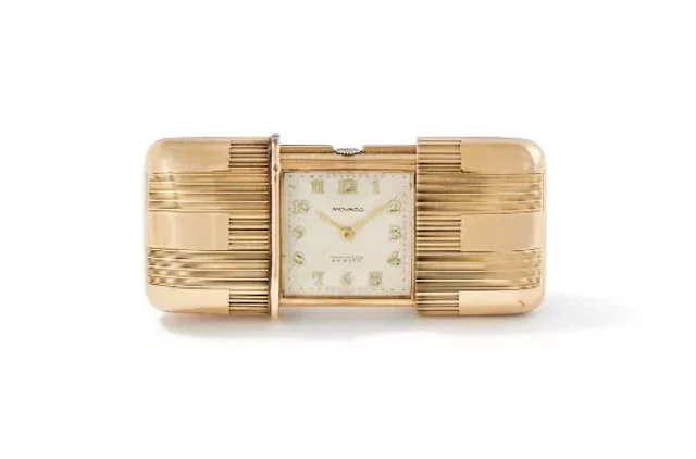 MOVADO, A 9 CARAT GOLD PURSE WATCH