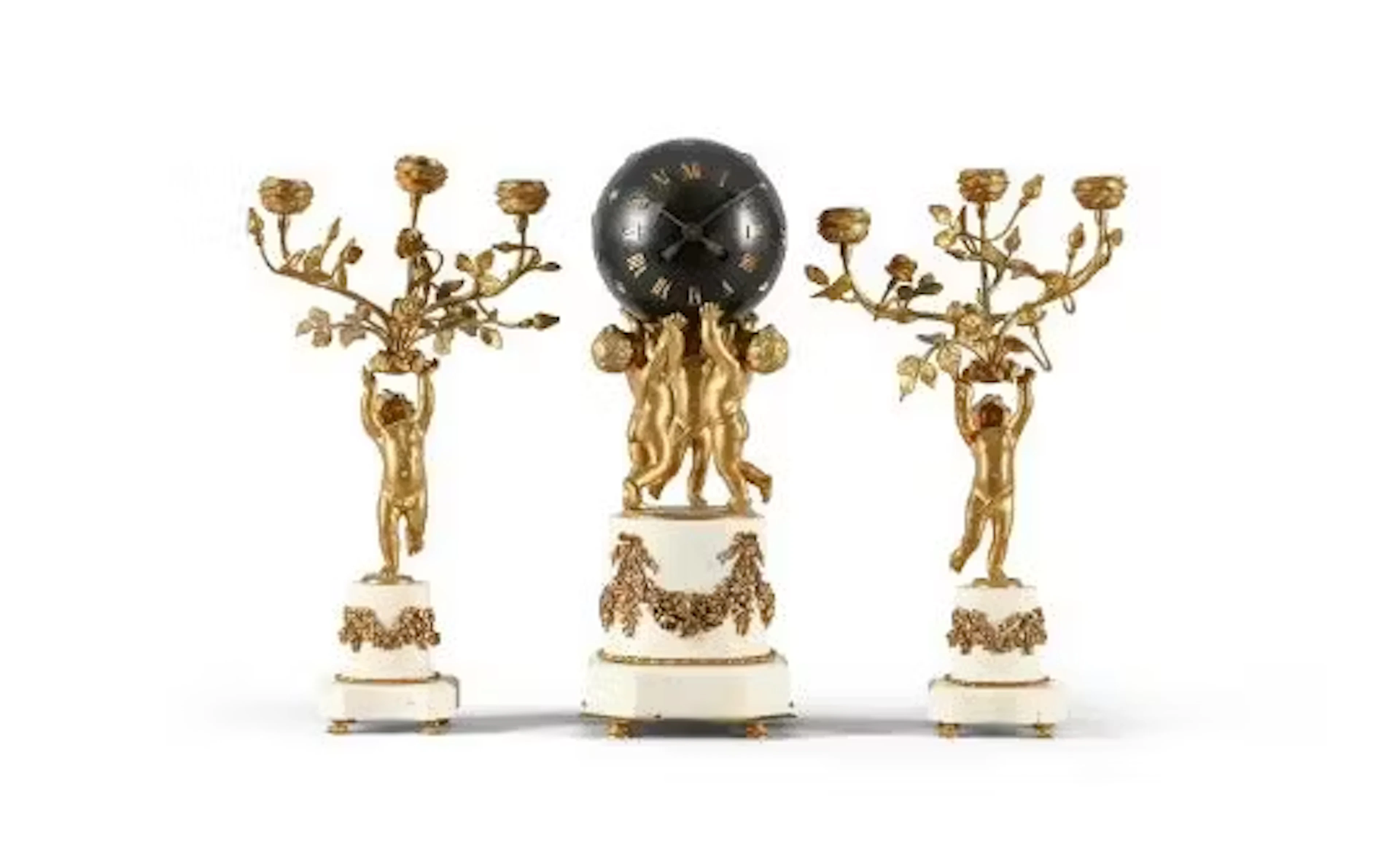 A FRENCH GILT AND PATINATED BRASS MOUNTED WHITE MARBLE MANTEL CLOCK GARNITURE