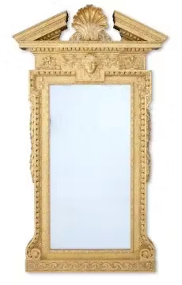 ‡ A GEORGE II CARVED GILTWOOD MIRROR, CIRCA 1740