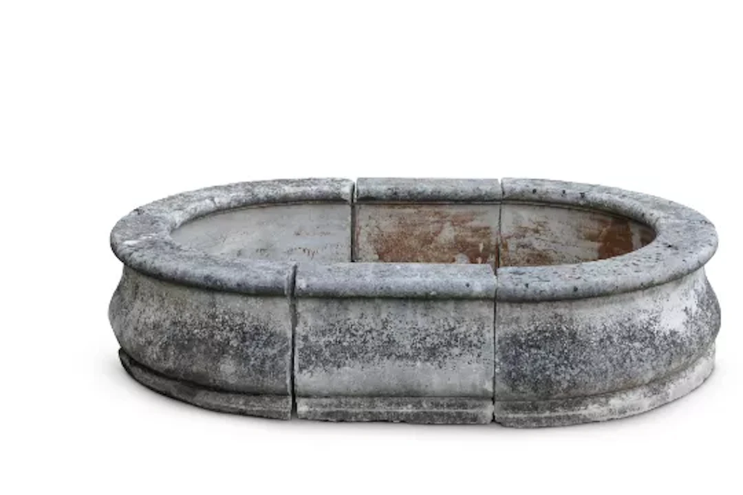 A, LARGE COMPOSITION STONE OVOID PLANTER OR FOUNTAIN SURROUND