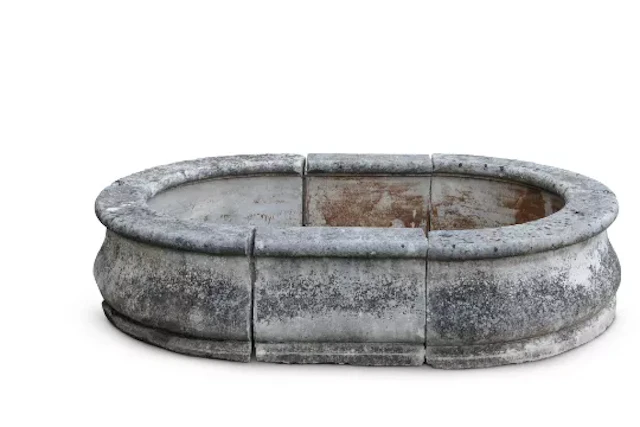 A, LARGE COMPOSITION STONE OVOID PLANTER OR FOUNTAIN SURROUND