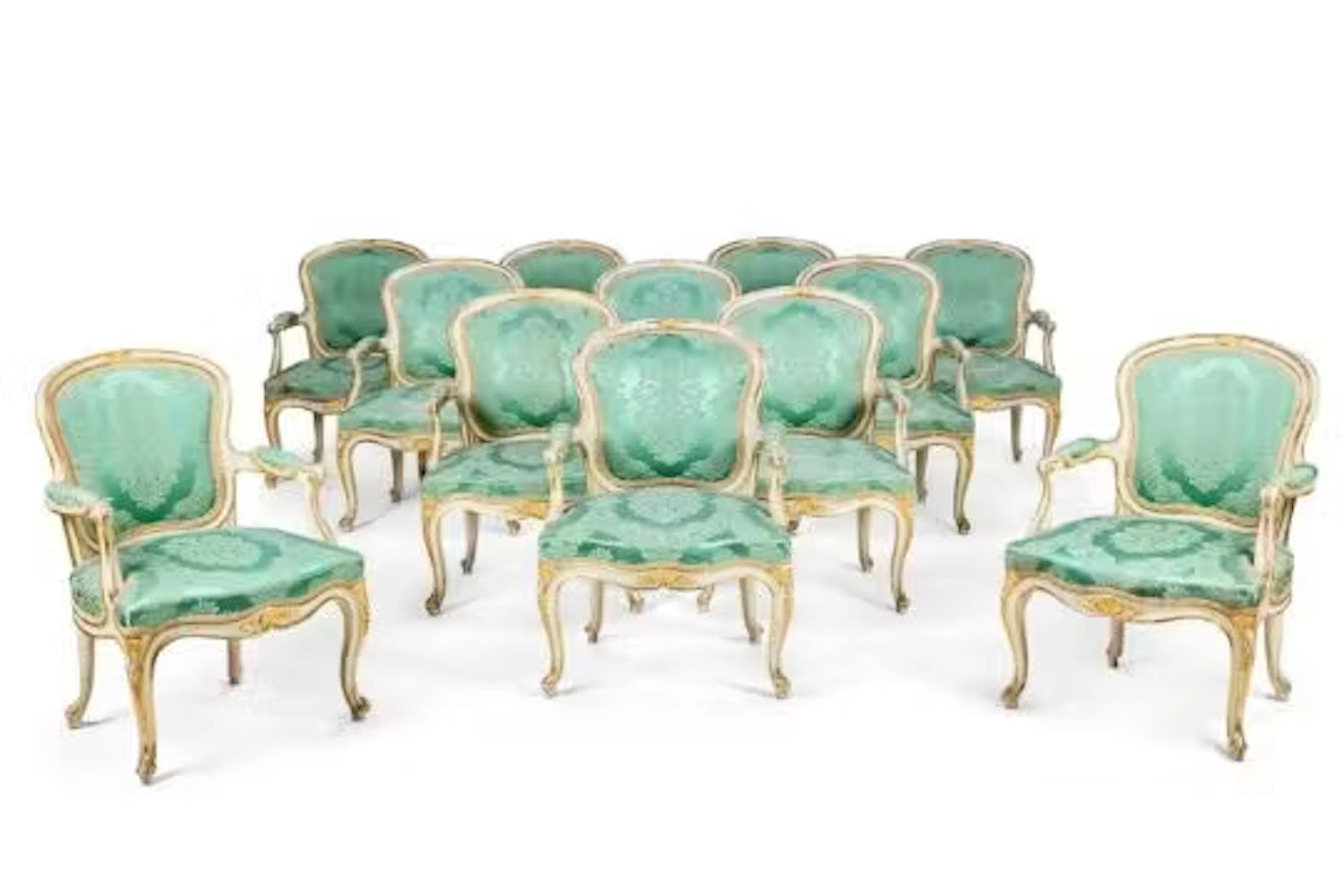 A SET OF TWELVE GEORGE III WHITE PAINTED AND PARCEL GILT ARMCHAIRS