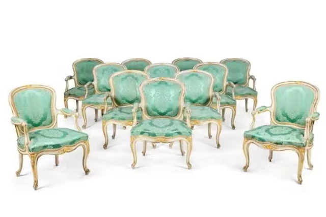 A SET OF TWELVE GEORGE III WHITE PAINTED AND PARCEL GILT ARMCHAIRS