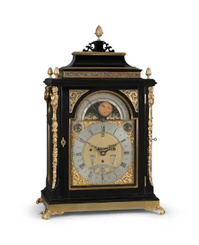 AN IMPRESSIVE GEORGE III EBONISED TWELVE-TUNE MUSICAL TABLE CLOCK