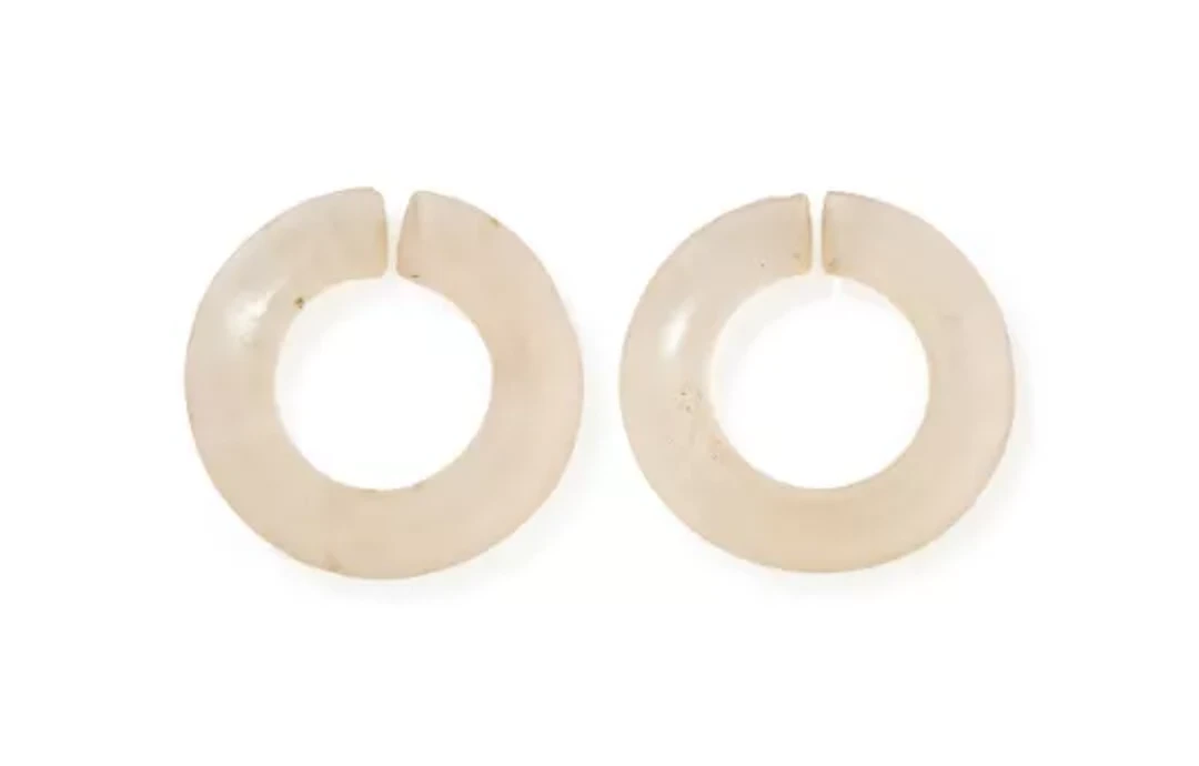 Two Chinese rock crystal jue discs, Xiajiadian culture, circa 2000BC