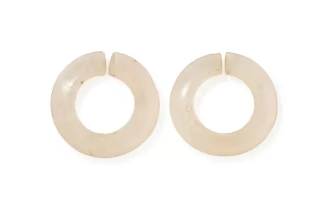 Two Chinese rock crystal jue discs, Xiajiadian culture, circa 2000BC