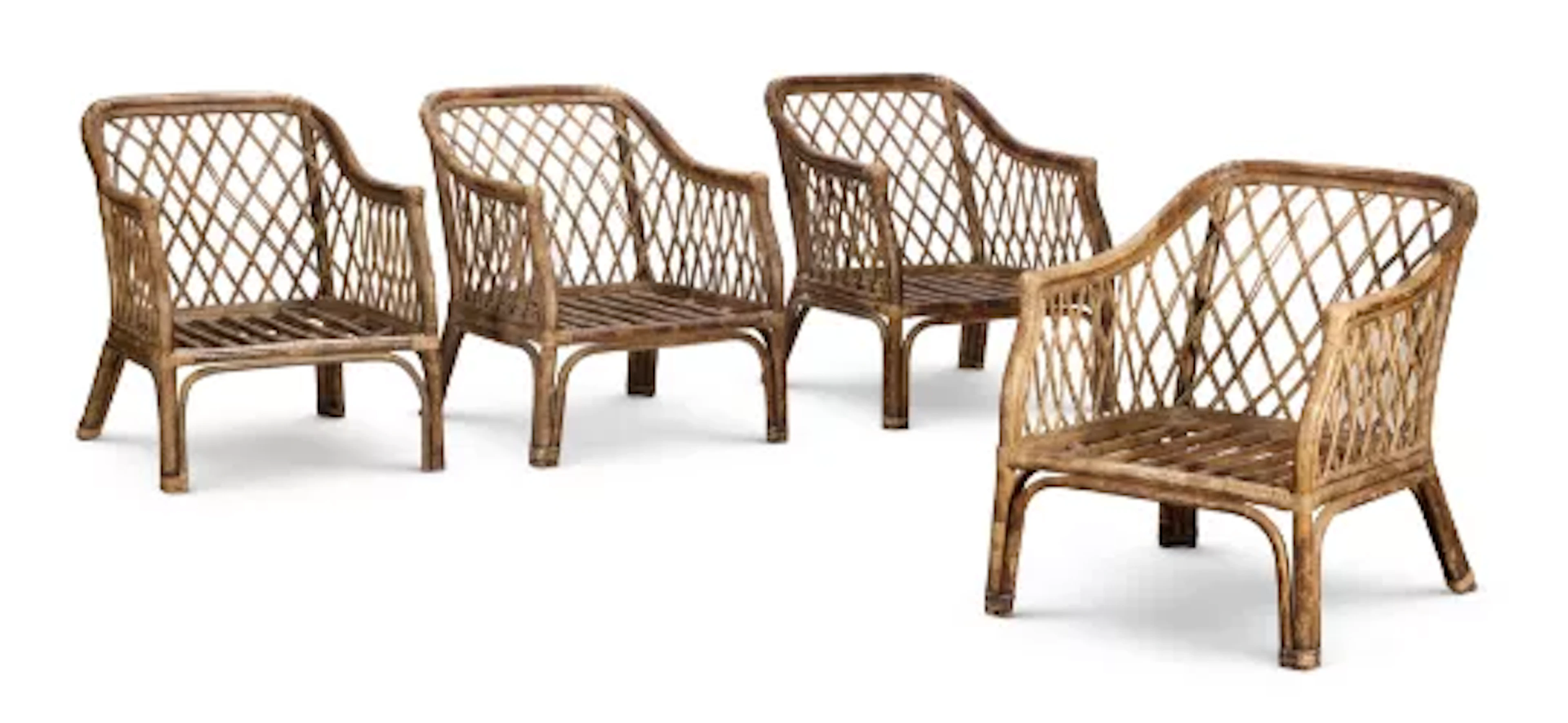 A SET OF FOUR CEYLONESE RATTAN GARDEN ARMCHAIRS, CIRCA 1920