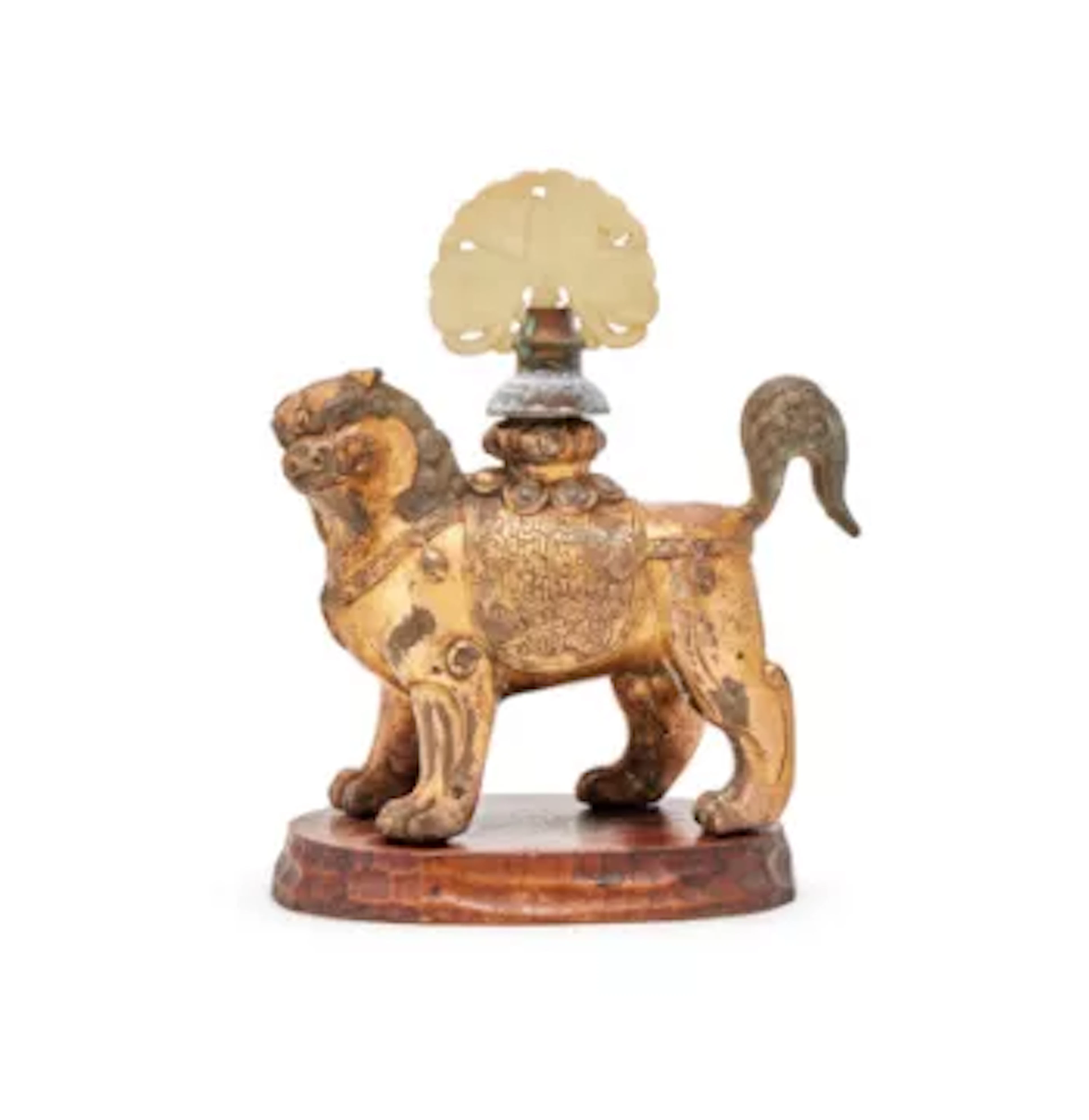A Chinese gilt bronze model of a Buddhist lion, Tang Dynasty (618-907)